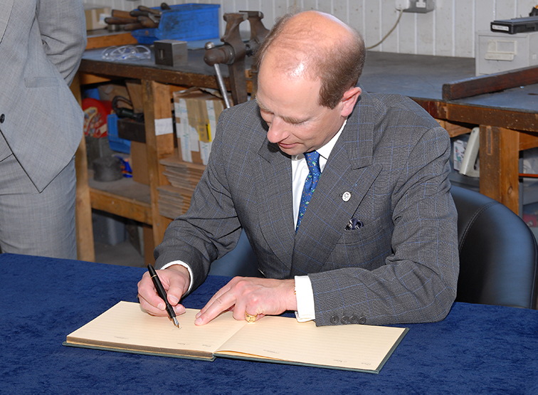 Prince Edward signs book